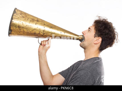Young man using an old megaphone Stock Photo