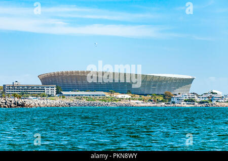 A paraglider above the Cape Town football stadium by the sea, South Africa Stock Photo