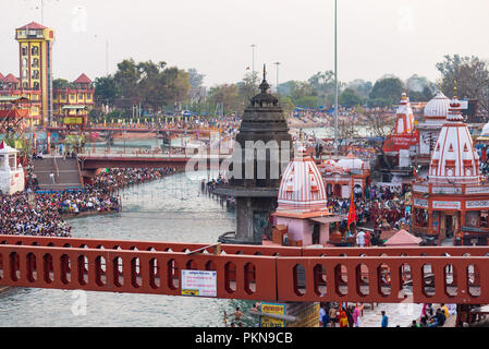 Haridwar, India - March 20, 2017: Holy ghats and temples at Haridwar, India, sacred town for Hindu religion. Pilgrims praying and bathing in the Gange Stock Photo