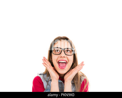 Bright excited young woman in glasses looking up in happiness isolated on white background Stock Photo