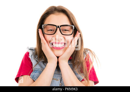 Happy young cool woman in glasses touching cheeks in excitement looking at camera isolated on white background Stock Photo