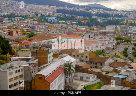 QUITO, ECUADOR - AUGUST 24, 2018: Cityscape panoramic aerial view from the Basilica Church viewpoint of Quito city, Ecuador Stock Photo