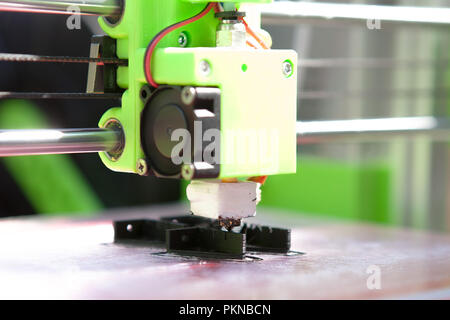 A desktop 3d printer in the laboratory for prints a structure from a polymer. Stock Photo