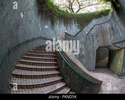 Spiral staircase of underground crossing in tunnel at Fort Canning Park, Singapore Stock Photo