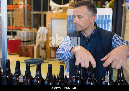 bottling factory employee at work Stock Photo