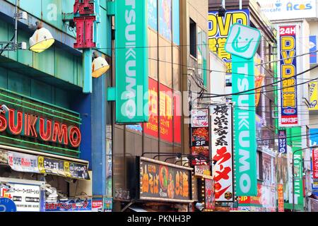 TOKYO, JAPAN - DECEMBER 4, 2016: Neons at Akihabara district of Tokyo, Japan. Akihabara is also known as Electric Town district, it has reputation for Stock Photo