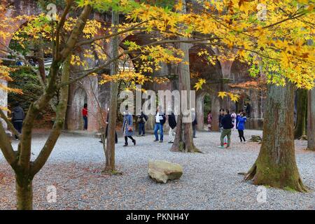 KYOTO, JAPAN - NOVEMBER 24, 2016: People visit Suirokaku aqueduct in Kyoto, Japan. The unique aqueduct structure runs through Nanzenji Temple grounds. Stock Photo