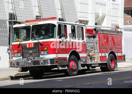 SAN FRANCISCO, USA - APRIL 9, 2014: San Francisco fire engine parked in the street. SF Fire Department responded to 120,536 emergency calls in 2012. Stock Photo