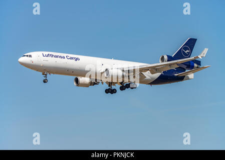 A Lufthansa type MD-11 cargo aircraft (D-ALCB) with new logo approaching Frankfurt Airport Stock Photo
