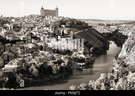 Cityscape of Toledo, Spain. Famous Alcazar on the right, cathedral in the middle. Tagus river. Stock Photo
