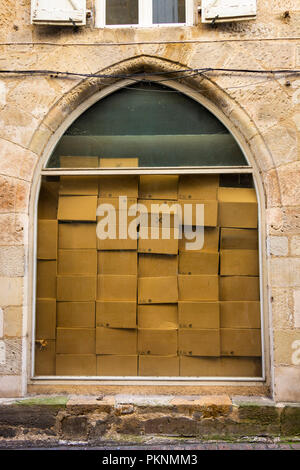 Stacked cardboard boxes in a window, Figeac, lot department, Occitanie, France, Europe Stock Photo