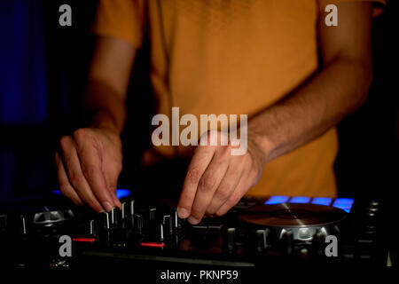 DJ remote, turntables,and hands . Night life at the club, party Stock Photo