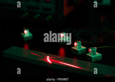 Laser experiment in photonics laboratory. Stock Photo