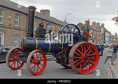 Close up detail of a vintage steam traction engine built in the UK by Clayton and Shuttleworth of Lincoln driving in a town street Stock Photo