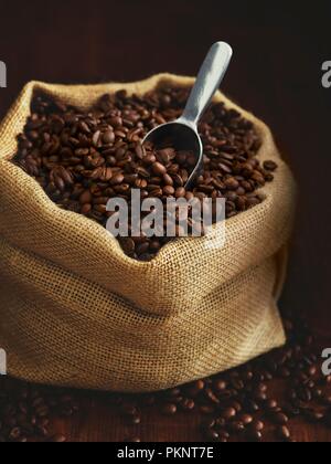 Sack full of coffee beans. Stock Photo