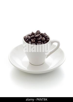 Coffee cup filled with beans. Stock Photo