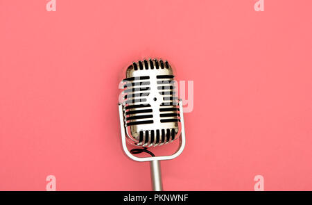 Microphone image on pink background, old vintage style. Stock Photo