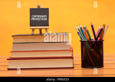 Copyright Protection conceptual theme on wooden background. Stock Photo