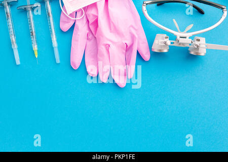 Medical equipments including surgical instruments on a blue background. top view, copy spase Stock Photo