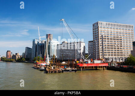 Jack-up barges being used for construction work on the Thames embankment by Vauxhall Bridge, London, UK. Stock Photo