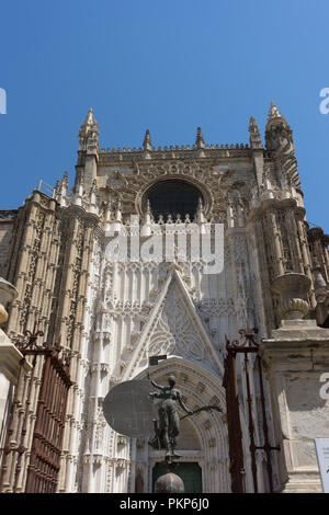 Seville, Spain - 19 June 2017: The entrance of the gothic church in Seville, Spain, Europe. The Seville Cathedral, also known as Cathedral of Saint Ma Stock Photo