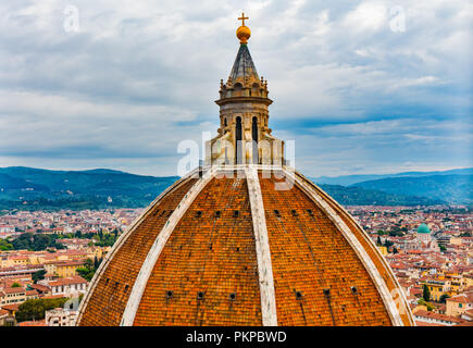 Large Dome Golden Cross Duomo Cathedral Church Florence Italy.  Finished 1400s.  Formal name Cathedral di Santa Maria del Fiore. Stock Photo