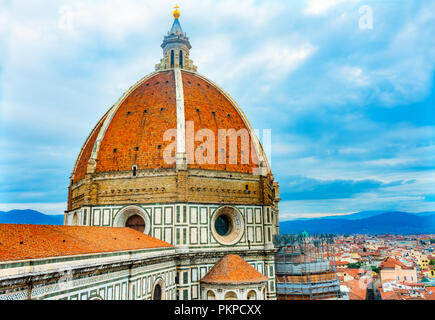 Large Dome Golden Cross Duomo Cathedral Church Florence Italy.  Finished 1400s.  Formal name Cathedral di Santa Maria del Fiore. Stock Photo