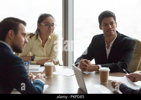 Multiracial business people at meeting in conference room negoti Stock Photo