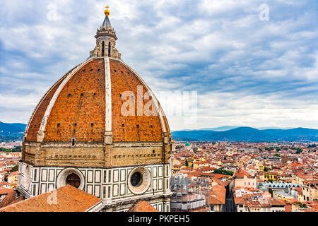 Large Dome Golden Cross Duomo Cathedral Church Florence Italy.  Finished 1400s.  Formal name Cathedral di Santa Maria del Fiore. Stock Photo