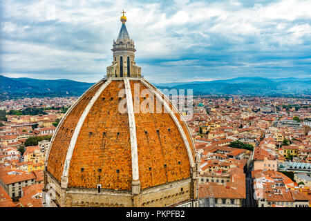 Large Dome Golden Cross Duomo Cathedral Church Florence Italy.  Finished 1400s.  Formal name Cathedral di Santa Maria del Fiore. Stock Photo