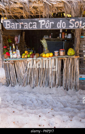 CAIRU, BRAZIL - CIRCA FEBRUARY, 2018: Rustic Brazilian beach shack 'Barraca Por do Sol' sells alcoholic drinks made with tropical fruits. Stock Photo