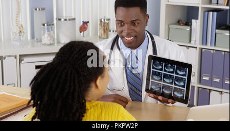 Two African American medical specialists working together on computer Stock Photo