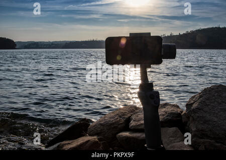 Cell phone filming landscape with gimbal. Sunset on the Serra de Tomar. Rio zezere, Portugal. Stock Photo