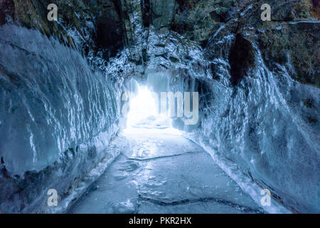 Winter frozen ice cave at frozen lake Baikal in Siberia, Russia Stock Photo