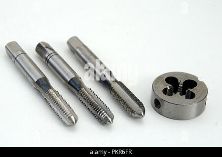 First, second, and plug tap and die for cutting of 6 mm threads. Stock Photo