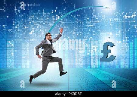 Businessman chasing money on fishing rod Stock Photo - Alamy