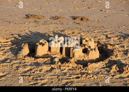 Remains of sandcastle on beach, Hunstanton, Norfolk, England Stock Photo