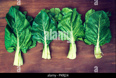 Freshly organic picked green  chard on wooden background Stock Photo