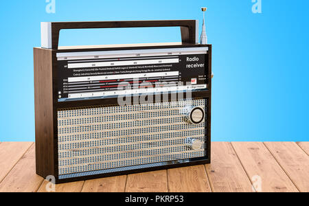 Radio receiver on the wooden desk, 3D rendering Stock Photo