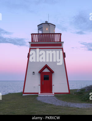 Fox Point (Fishing Point) Lighthouse on West Street in St. Anthony, Newfoundland and Labrador at twilight Stock Photo
