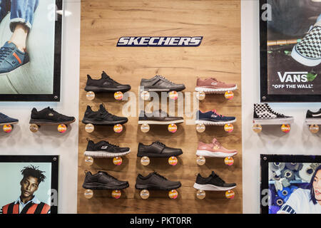 BELGRADE, SERBIA - SEPTEMBER 2, 2018: Skechers logo and sneakers on display in the window of their main retailer in Belgrade. Skechers is an American  Stock Photo