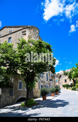 Streets, shops, and architecture of the hilltop village of Menerbes in the Luberon are of Provence, France Stock Photo