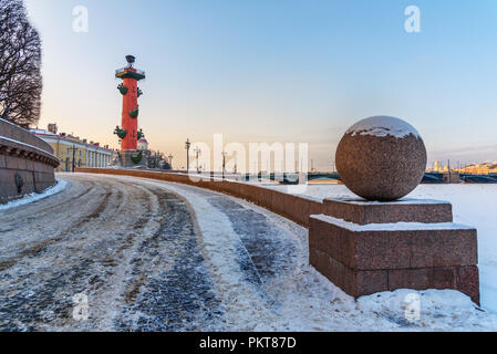 Rostral column on Vasilievsky island at sunset in winter in Saint Petersburg. Russia Stock Photo