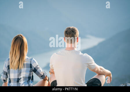 young couple doing yoga in nature Stock Photo
