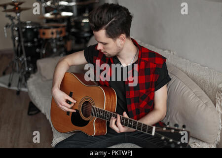 Young guy practicing guitar Stock Photo