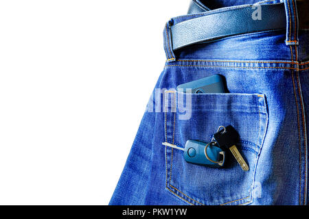 Jeans on white background. smartphone in your pocket. on top of the keys to the car Stock Photo