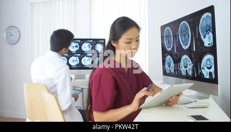 Multi-ethnic medical team working in the office Stock Photo