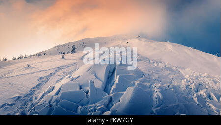 Snow avalanche in winter mountains Stock Photo