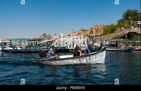 Tourists in boat returning from Temple of Philae, Lake Nasser, River Nile, Aswan, Egypt, Africa Stock Photo