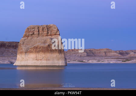The lone rock in Lake powell near Page, Arizona. This was taken just north of Arizona Utah border. Stock Photo